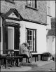 Old woman dozing on pub bench.jpg