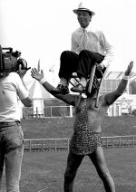 Strongman holding up Reporter on chair with his teeth Mamiya C330f.jpg