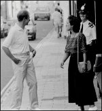 Pedestrians and policeman sharing a joke Olympus OM1 1993 04-13.jpg Pedestrians and policeman sharing a joke Olympus OM1 1993 04-13.jpg
