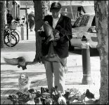 Man feeding pigeons Bristol Leica M3 08.jpg
