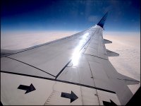 737 wing from passenger window E-PM1 9051249.JPG