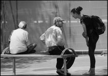 Young woman talking to man on bench Sidwell Street Exeter P113 0937.JPG