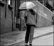Young man with see through umbrella Exeter P1011870.JPG