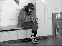 Girl on bench new Exeter Bus Station FZ82 P1000935.JPG