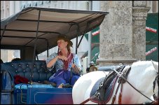 Woman driving tourist carriage Innsbruck D5100 A0094.JPG