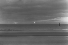 Cloudy with sunlit windmills.jpg