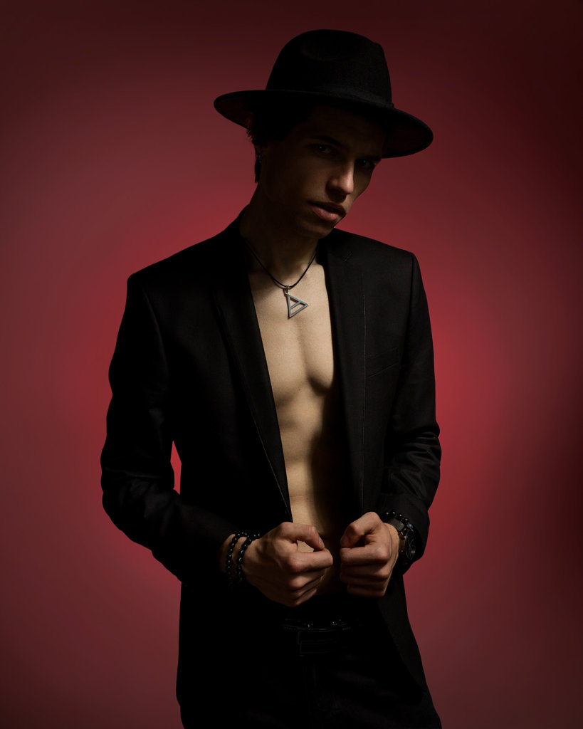 Male chest in suit and hat